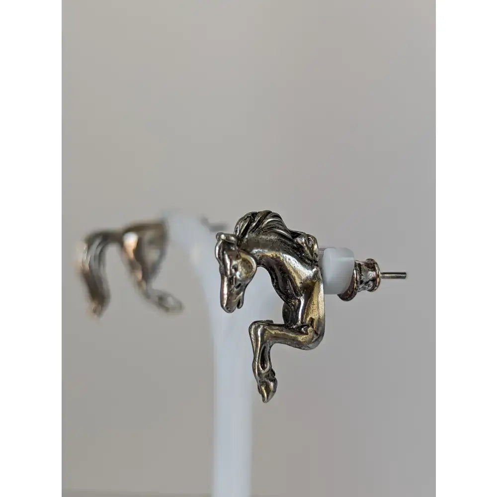 Silver steed horse studs earrings feature detailed silver front and hind horse studs with white plastic backings