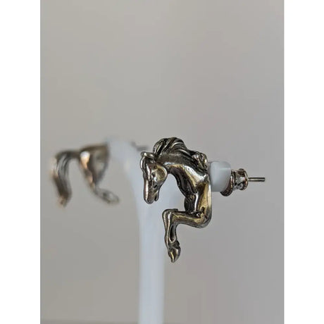 Silver steed horse studs earrings feature detailed silver front and hind horse studs with white plastic backings