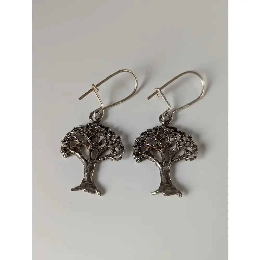 Silver steed fruit dropped earrings featuring silver steed fruit tree design with intricate filigree and hook closures