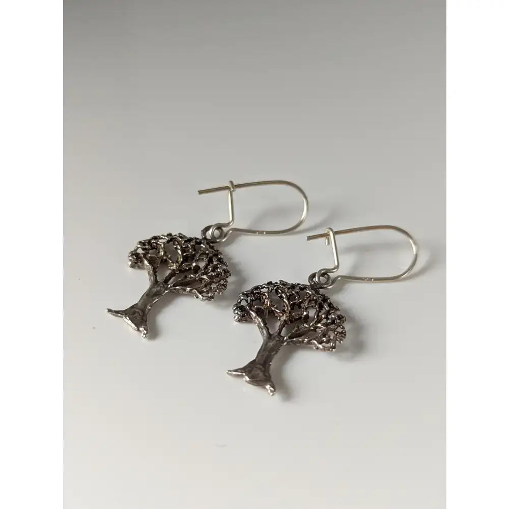 Silver steed fruit dropped earrings featuring intricate silver steed fruit tree branches and detailed leaves design