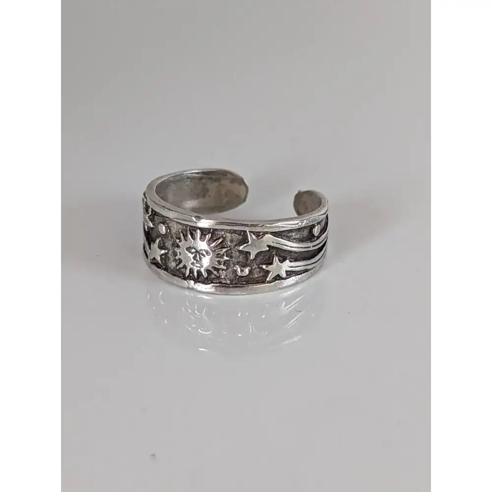 Silver steed galaxy adjustable silver band featuring a silver toe ring with embossed stars and sun design