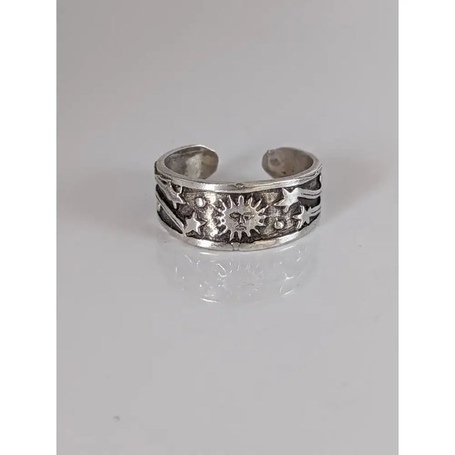 Silver steed galaxy adjustable silver band featuring a silver-toned open toe ring with embossed celestial designs