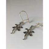 Silver steed gecko dropped earrings in silver metal with unique gecko design featuring detailed claws and tails