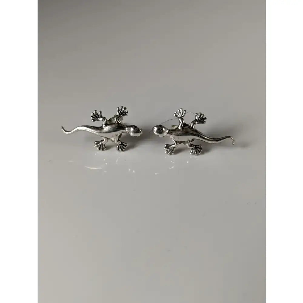Silver steed gecko stud earrings in silver with detailed claws and tails for a unique look