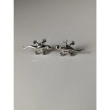 Silver steed gecko stud earrings in silver with detailed claws and tails for a unique look