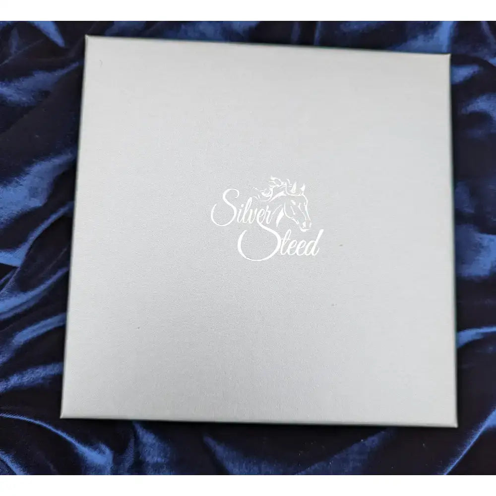 Silver steed gift boxes featuring a silver branded gift box with subtle embossed logo and elegant white cursive script