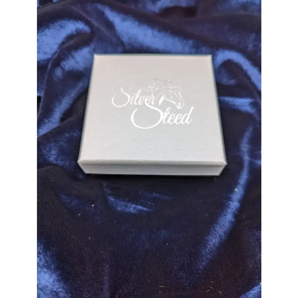 Silver steed gift boxes featuring a silver jewelry box with elegant cursive lettering and a subtle horse silhouette