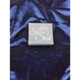 Silver steed gift box with white horse silhouette and cursive lettering on dark blue velvet for steed gift boxes