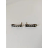 Silver steed greek motive stud earrings with silver bar design and black and white geometric diamond pattern