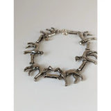 Silver steed greyhound silver bracelet crafted with linked horse figurines in a sleek continuous running pattern