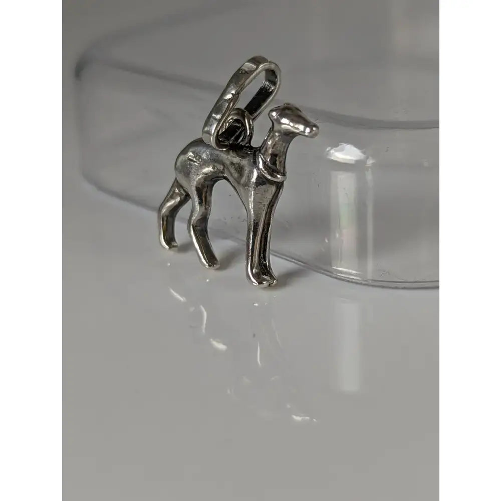 Silver steed greyhound silver pendant is a polished silver dog charm with loop perfect for equestrian lovers