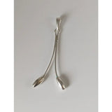 Silver pendant with two slender teardrop shapes curving from a central bail in silver steed hanging stem style