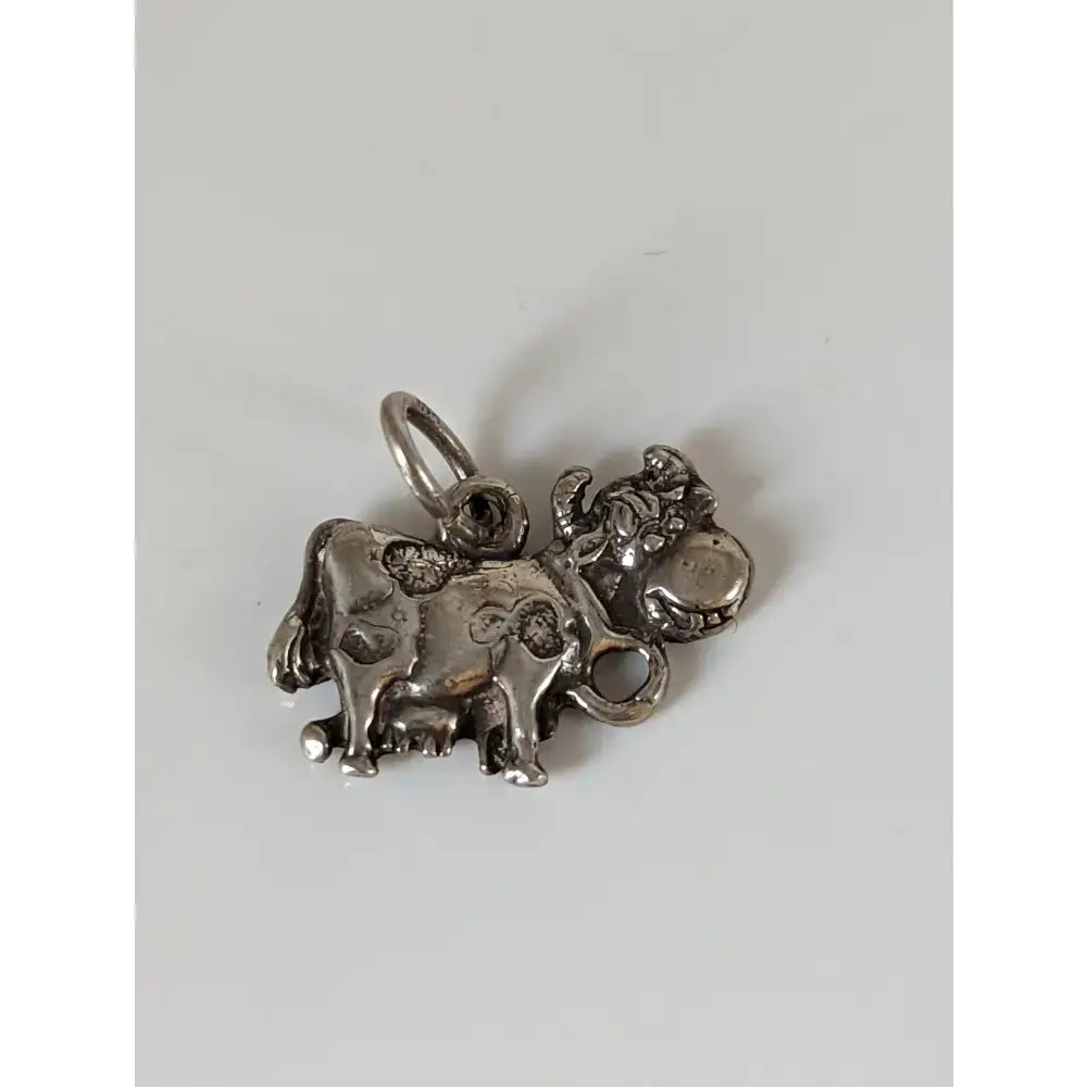 Silver steed happy cow silver pendant with intricate engraved patterns and polished silver finish charm