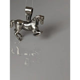 Silver steed haute ecole pendant featuring a detailed silver equestrian pendant with polished metallic finish
