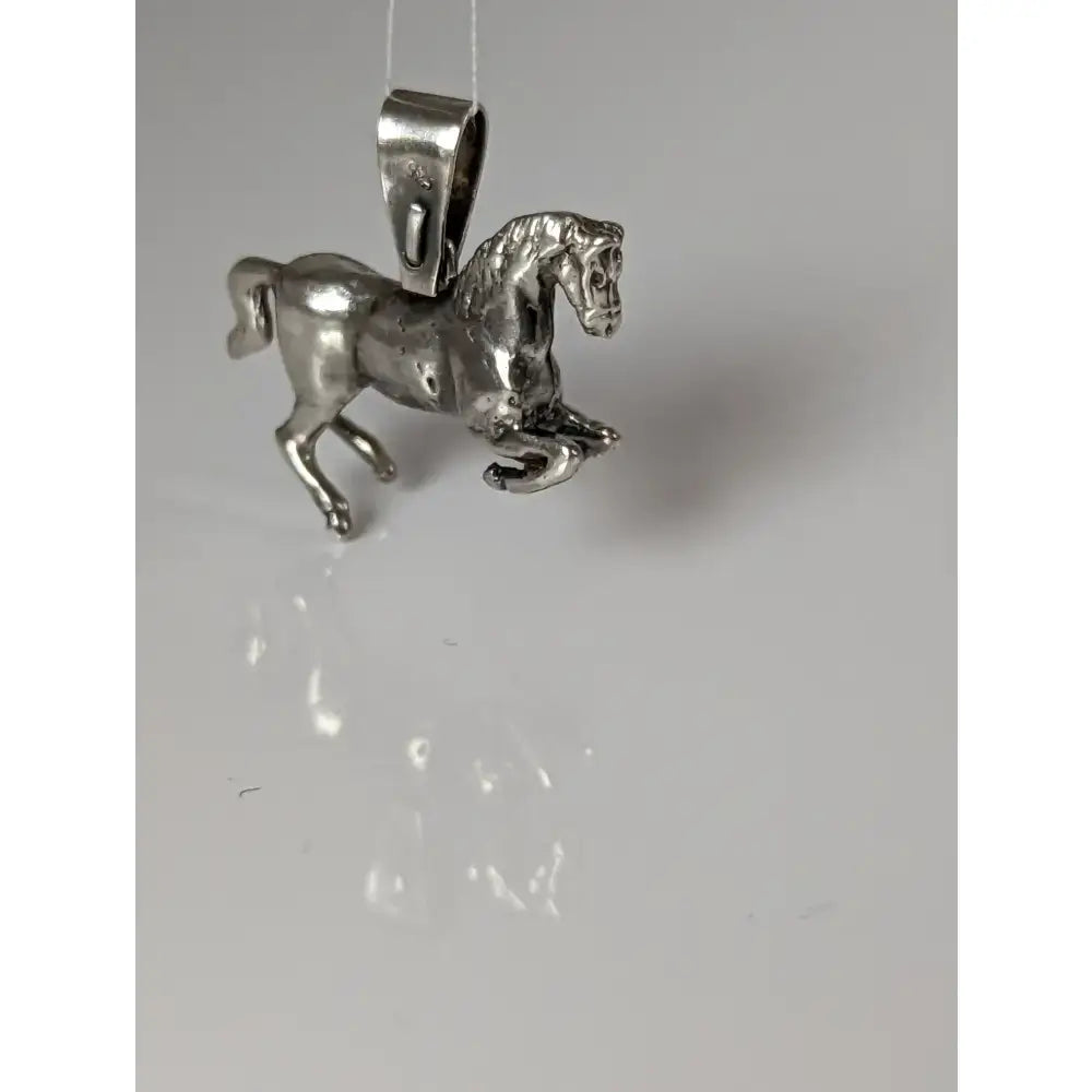 Silver steed haute ecole pendant featuring a detailed silver horse with polished metallic finish equestrian pendant