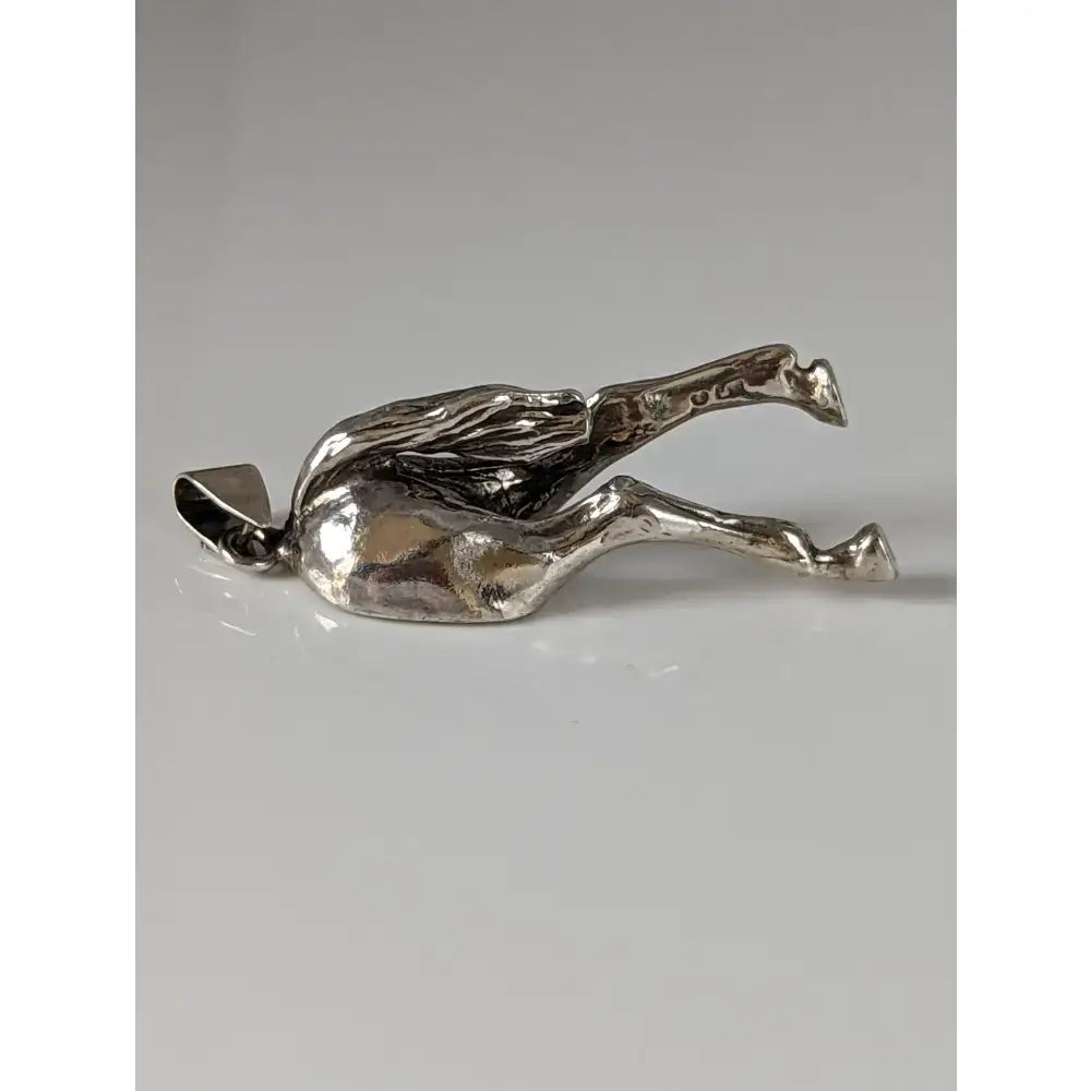Silver steed hindquarters sterling silver pendant with textured sculpted surface and small loop for attachment