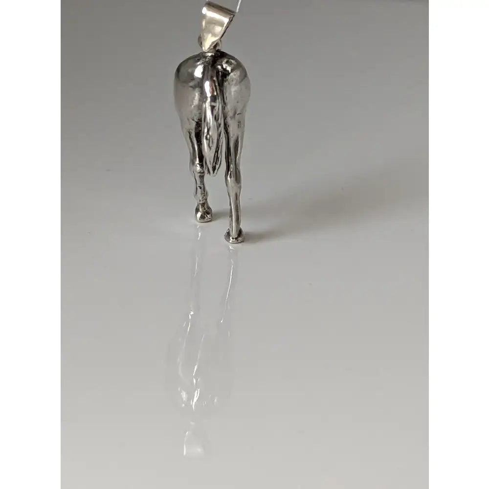 Silver steed hindquarters sterling silver pendant with polished metallic finish and detailed horse legs and tail