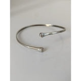 Silver steed hoofnail sterling silver cuff bangle with hammered texture and minimalist open-ended design