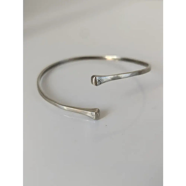 Silver steed hoofnail sterling silver cuff bangle with hammered texture and minimalist open-ended design