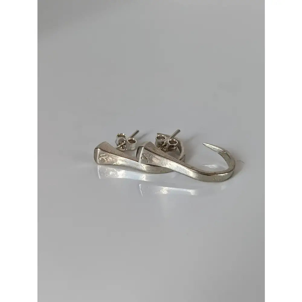 Silver steed hoofnail stud earrings with sleek silver hook design and subtle engraved detailing