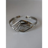 Silver steed horse head bangle featuring a sleek open design with polished silver steed horse and oxidized finish