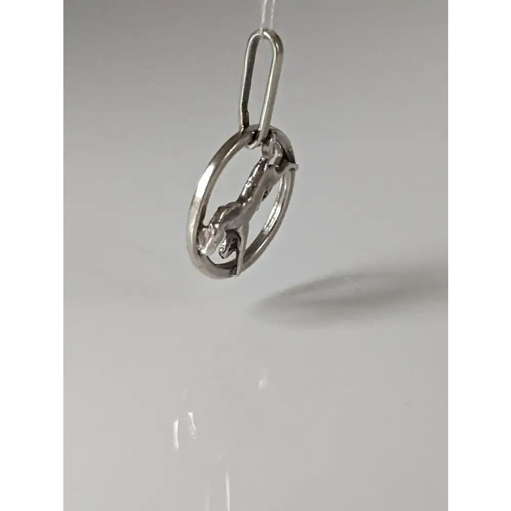 Silver steed horse pendant in silver-toned metal featuring a detailed steed horse inside an open circle ring