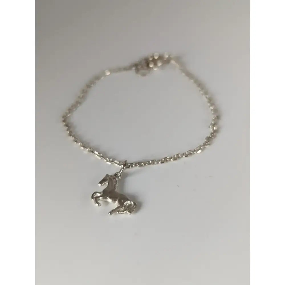 Silver steed horse chain delicate bracelet featuring a detailed horse charm with a polished sterling silver finish