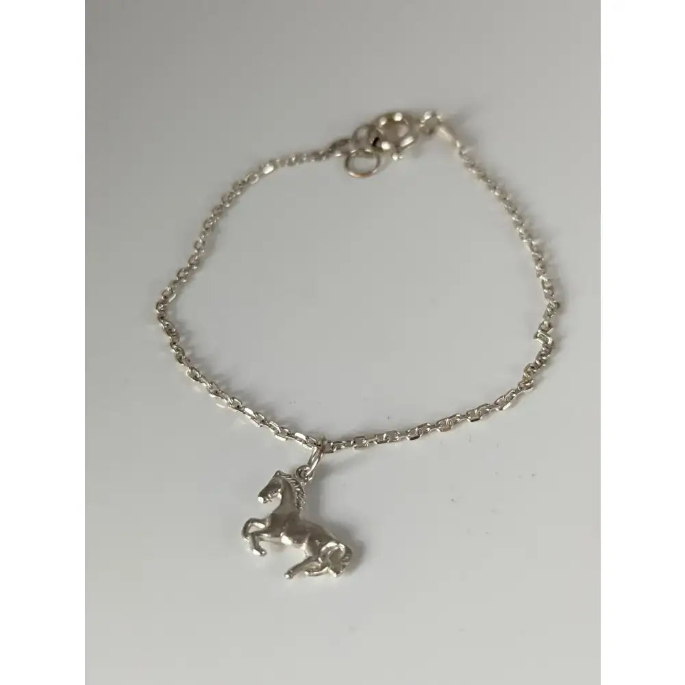 Silver steed horse chain delicate bracelet with detailed horse charm made of sterling silver and secure clasp
