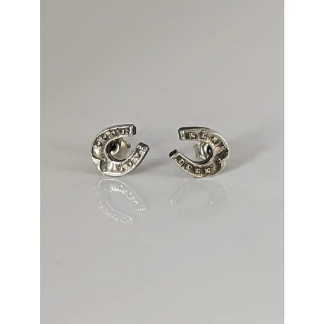 Silver steed horseshoe silver stud earrings with textured antiqued finish and subtle engraved edge detailing