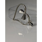 Silver steed horseshoe heart silver pendant featuring a textured silver pendant with an ankh symbol and attachment loop