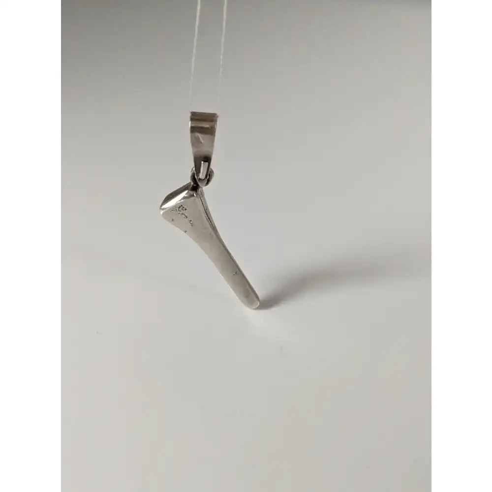 Silver pendant shaped like an axe with polished finish and engraved details from the silver steed horseshoe nail collection