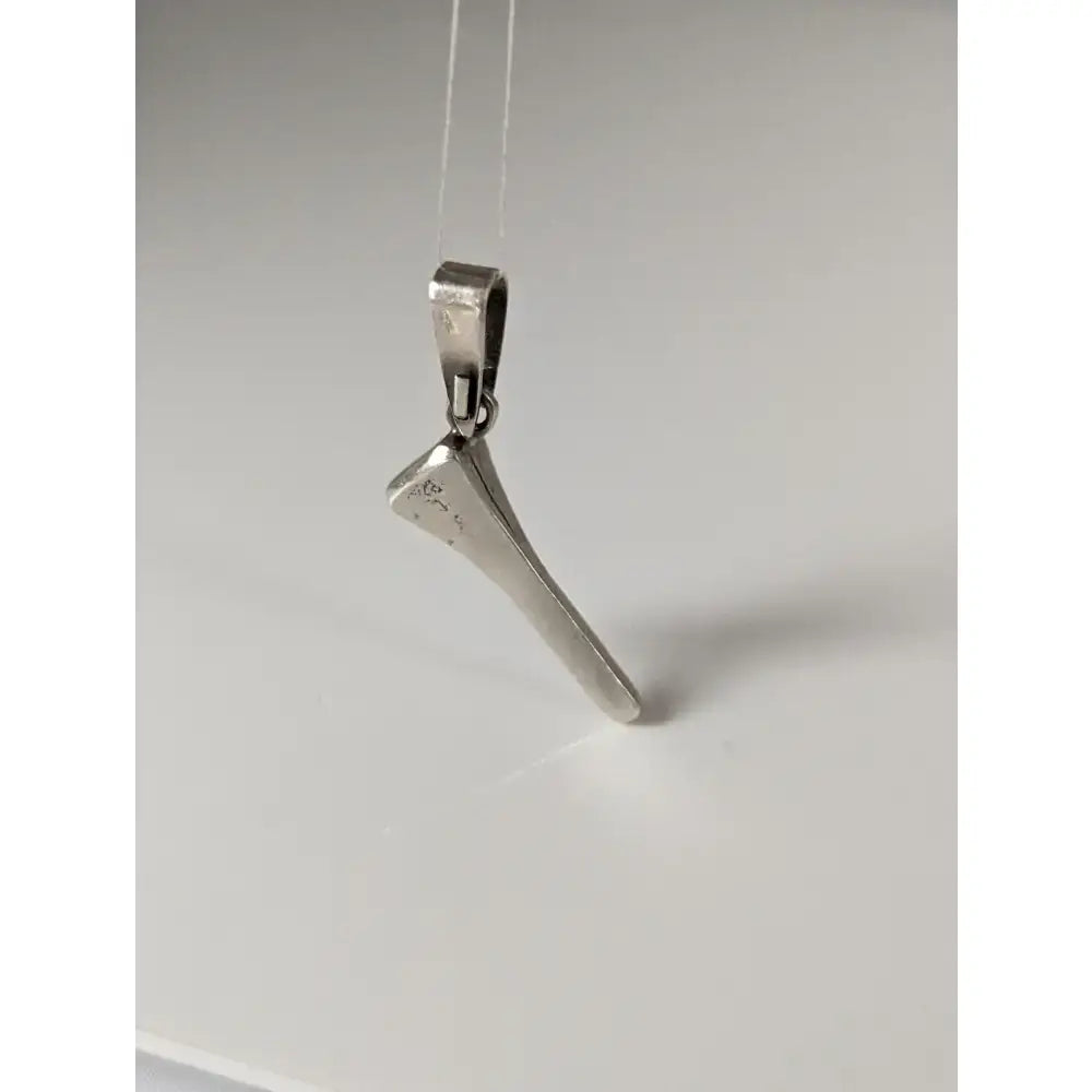 Silver steed horseshoe nail silver pendant featuring a polished silver-colored metal nail with engraved markings