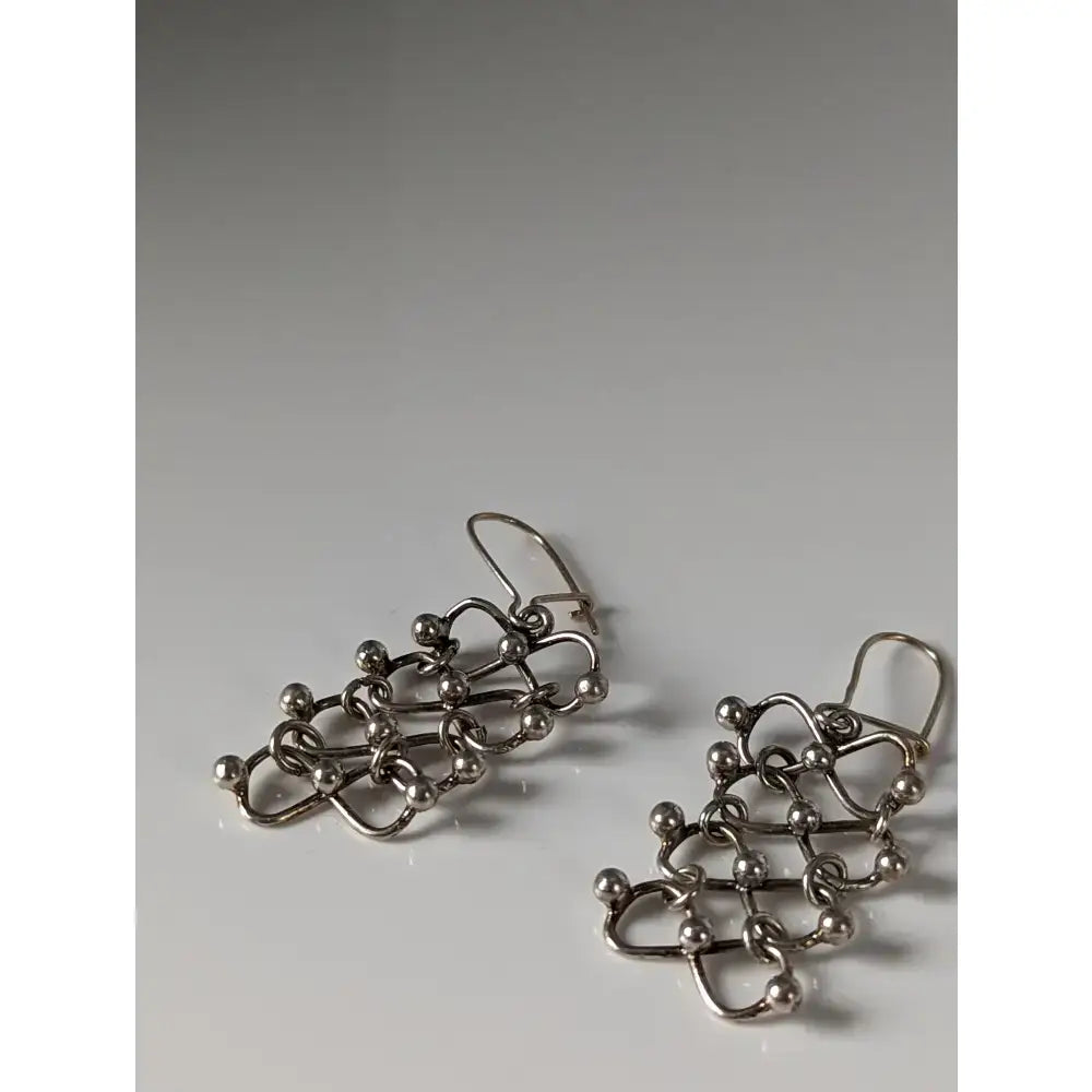 Silver steed infinity silver chain dropped earrings with spherical beads and a modern geometric design