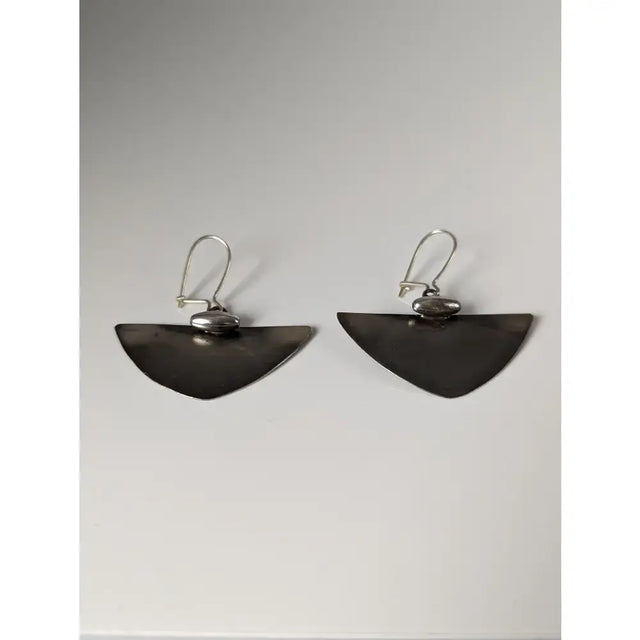 Silver steed isosceles dropped earrings in silver tone with a matte finish and subtle textured detail