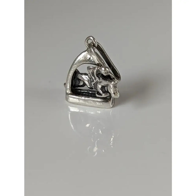 Silver steed jump silver pendant featuring a stirrup jockey charm with polished metallic finish and detailed motion design
