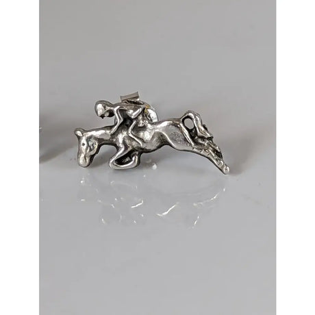 Silver steed jumping sterling silver stud earrings with detailed rider on horseback in mid-jump design