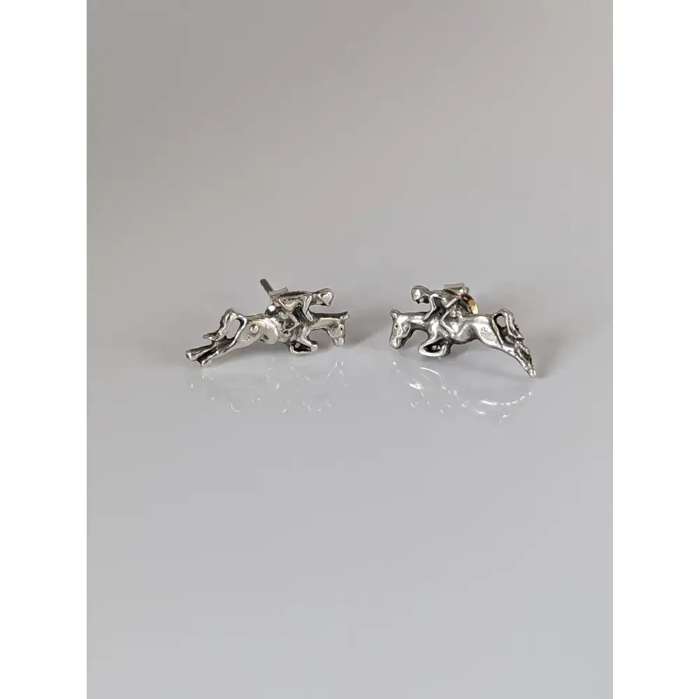 Silver steed jumping horse and rider stud earrings in sterling silver with intricate detailing