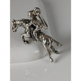 Silver steed jumping jockey silver pendant featuring a detailed rider on horseback in polished silver metalwork