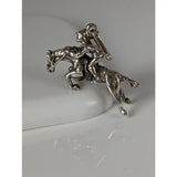 Silver steed jumping jockey silver pendant with detailed rider on horseback in metallic silver equestrian charm design