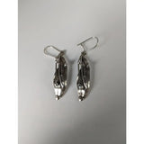 Silver steed kelp dropped earrings with textured layered silver leaf design and small spherical accents