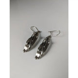 Silver steed kelp dropped earrings with sleek silver leaf shape and polished modern metallic finish