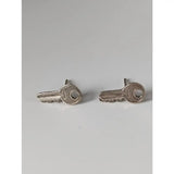 Silver steed key stud earrings featuring polished silver key shaped stud earrings with metallic finish