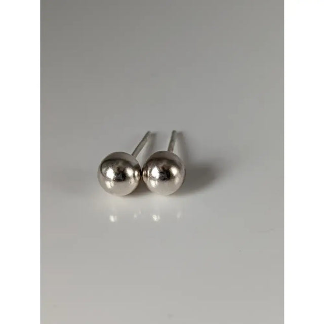Silver steed large sterling silver ball stud earrings with polished reflective spherical heads and slender posts