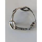 Silver steed large snaffle bangle is a sterling silver horsebit bracelet with a polished metallic finish and robust design
