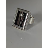 Silver steed large silver ring with a sculpted abstract figure and pearl accent in a frame silver ring design
