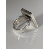 Silver steed large frame silver ring with a hammered texture and an adjustable band featuring a rectangular face