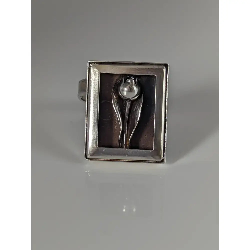 Silver steed large silver ring with a raised tulip design and pearl center in a minimalist frame silver ring