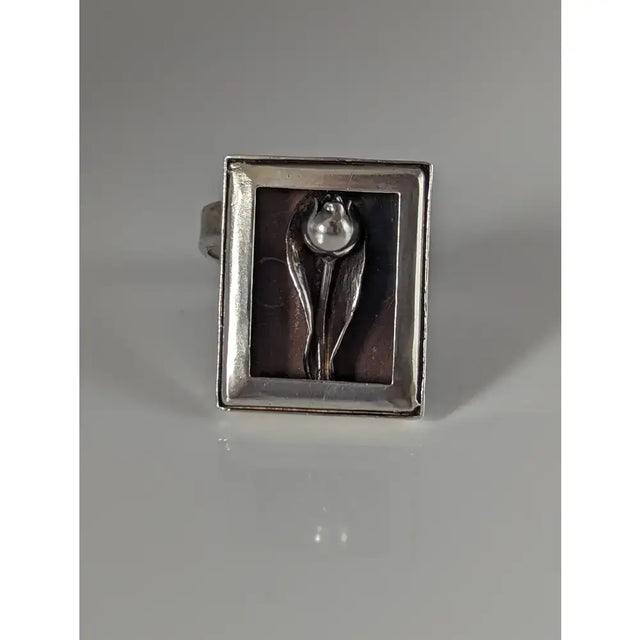 Silver steed large silver ring with a raised tulip design and pearl center in a minimalist frame silver ring