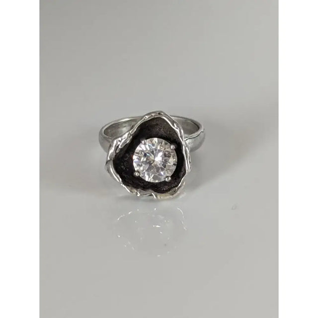 Silver steed large flower silver ring with a clear zirconia stone in a textured blackened metal setting perfect for equestrian jewelry