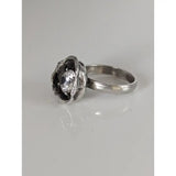 Silver steed large silver flower ring with textured organic setting holding oval-cut clear zirconia gemstone equestrian jewelry